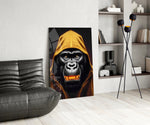 Gele met capuchon gorilla goud Grin – Glasschilderij