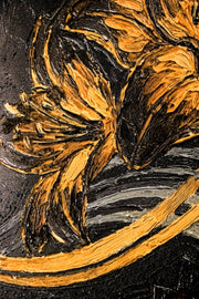 Close-up of a textured surface with gold and black colors